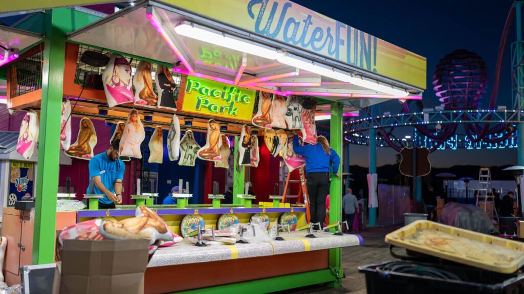 A picture of 11:11 using gamification at their event in 2022 with an interactive funfair game.