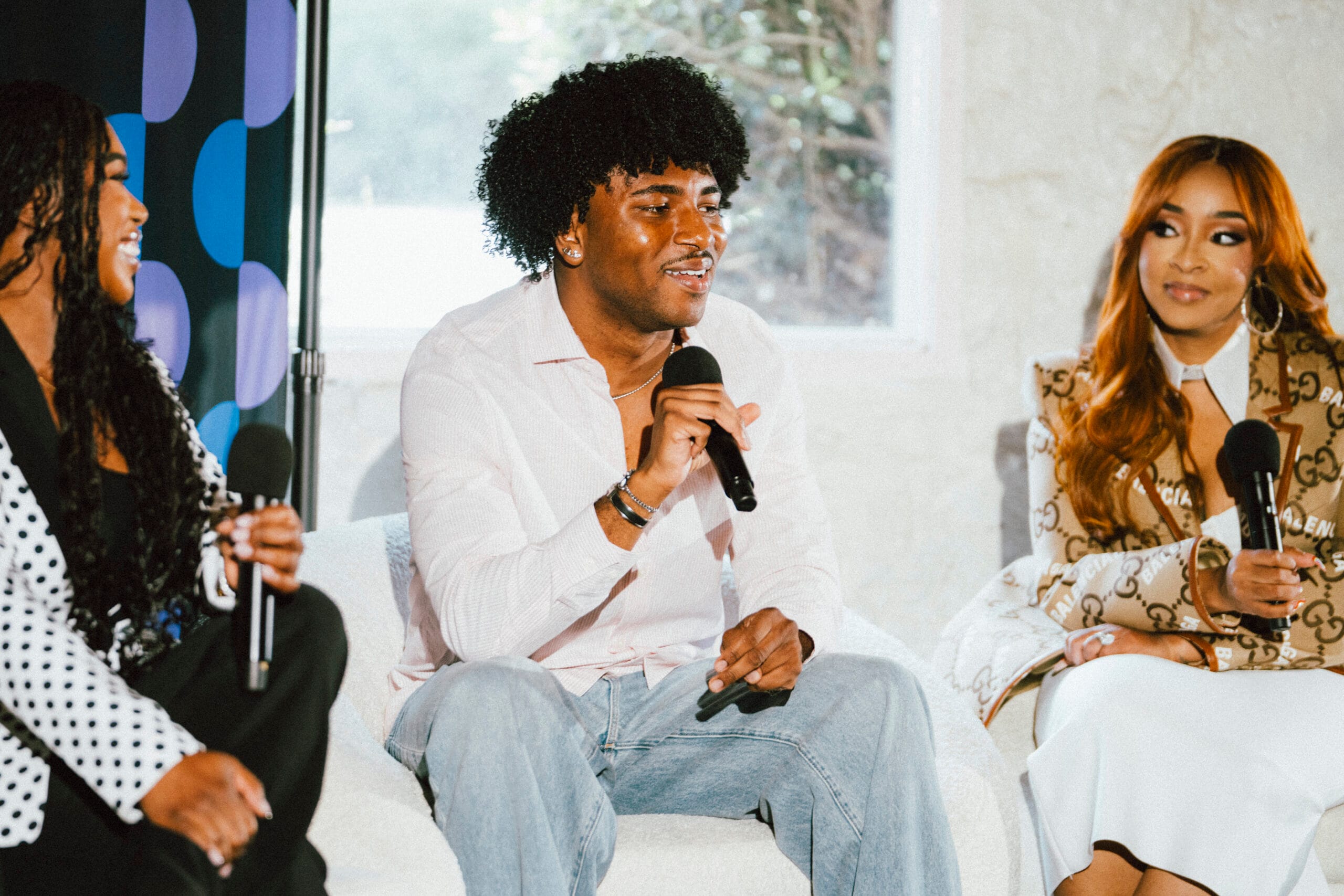 Panel of Black creators speaking at the TikTok Shop Creator Community Juneteenth Experience in Atlanta, 2025. A male is sp.eaking